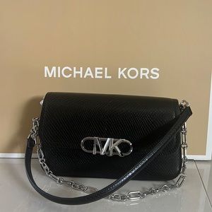 Brand new sold out Michael Kors Parker bag. Embossed leather and new with tags.
